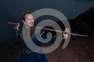 Medieval knight with spear in armor as style Game of Thrones in