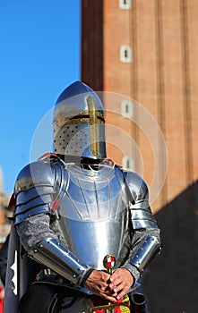 medieval knight in steel helmet and armor during a historical reenactment