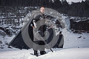 Medieval knight with sword in armor as style Game of Throne