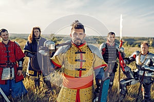 Medieval knights with swords poses in armor