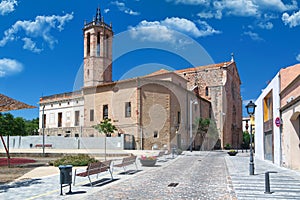 Medieval landmark in Caldes de Montbui, Holy Saint Mary Church against a blue Sky in Barcelona, Spain. Empty copy space