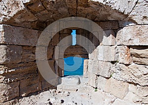 Medieval loophole in the old town on an island Rhodes, Greece.