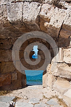 Medieval loophole in the old town on an island Rhodes, Greece.