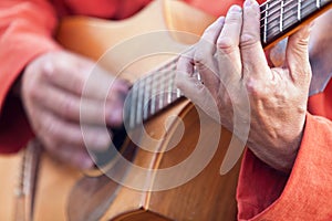 Medieval minstrel playing guitar photo
