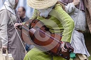 Medieval musical instrument Hurdy-gurdy held by a lady musician.. photo