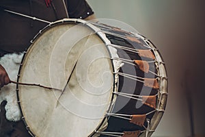 Medieval musician playing the drum