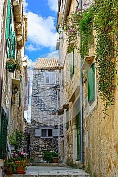 Medieval narrow street in old town of Hvar in Croatia