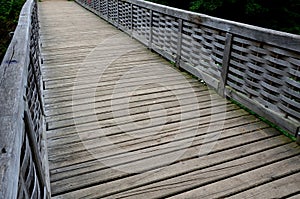 Medieval oak wood, bolted. Bridge over the moat. the railing is made of massive beams, between which several thin oak rods are wov