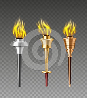 Medieval olympic torches set with burning fire. Ancient symbol of olympiad games concept photo