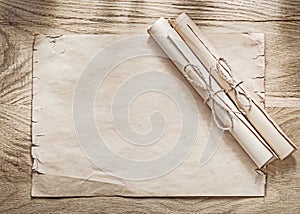 Medieval parchment paper rolls on wooden board