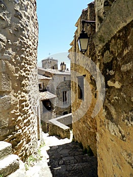 Medieval passage, stone wall with a vintage lantern, Saint-Montan, South of France photo