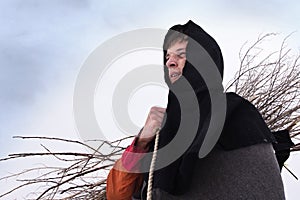 Medieval peasant with a firewood bundle