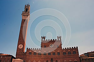 The medieval Piazza del Campo di Siena and the civic tower of the town hall