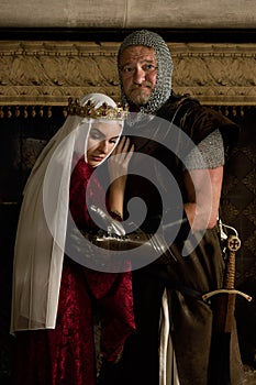 Medieval queen embracing knight