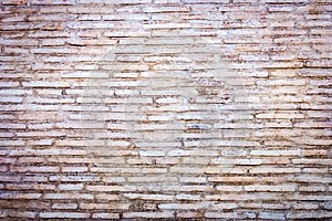 Medieval roman brick wall background. Travertine stone bricks in natural color.