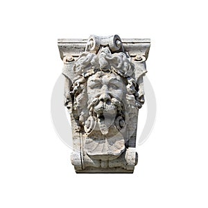 Medieval roman stone sculpture in form of lion head with his tongue hanging out isolated on white background closeup