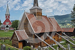 Medieval RÃ¸dven Stave Church with the RÃ¸dven Church in the background