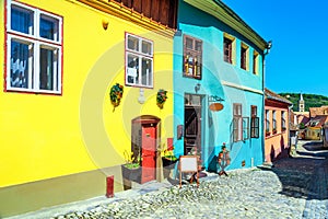 Medieval saxon street with colorful buildings in Sighisoara, Transylvania, Romania