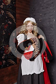 Medieval Seamstress with Vintage Dress.