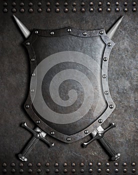 Medieval shield with two crossed swords over armour background