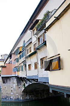 Medieval spandrel arch bridge Ponte Vecchio over Arno river in Florence, Italy