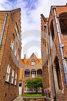 Medieval St. John`s Hospital beautiful facade and sculpture Bruges Belgium