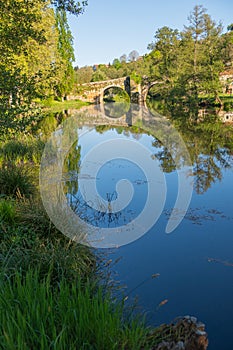 Medieval stone bridge over the Arnoia river in the beautiful village of Allariz, Galicia. Spain photo