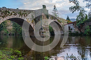 Medieval stone bridge over the Arnoia river in the town of Allariz. Province of Ourense. Galicia, Spain photo