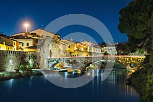 Medieval stone bridge in Prato, Italy photo