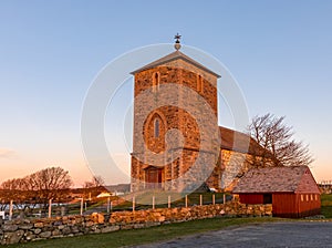 The medieval stone church at Avaldsnes, on the Island of Karmoy, Norway, vertical image of the front entrance and stairs