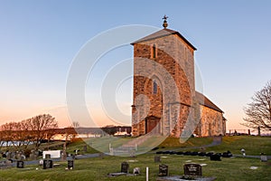 The medieval stone church at Avaldsnes, on the Island of Karmoy, Norway, vertical image of the front entrance and stairs