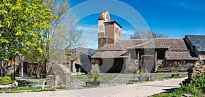 Medieval stone church in an old black village in Guadalajara, Majaelrayo. photo