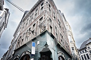 Medieval stone facades at the corner of a street in the city center of Liege, Belgium, belonging to residential urban buildings in photo