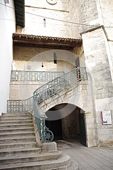 Medieval stone staircase and forged iron railing