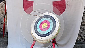 Medieval straw target with flying arrows and missing the target