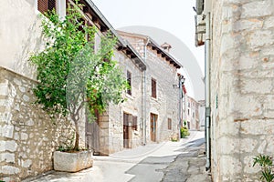 Medieval street with old houses on an early summer morning