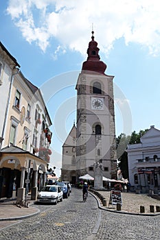 Medieval street and Saint George church in Ptuj, town on the Drava River banks, Slovenia