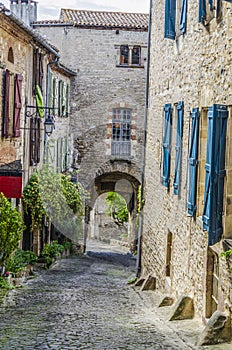 Medieval street of the village of cordes sur ciel photo