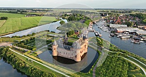 Medieval stronghold castle restored heritage culture monument for touristic museum purpose. Aerial overhead view. Dutch
