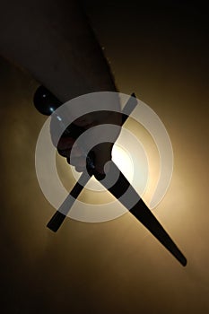 Medieval sword silhouette at backlighting photo