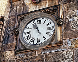 Medieval timepiece adjacent to the main door of the Prague City Hall. Czech Republic. Prague