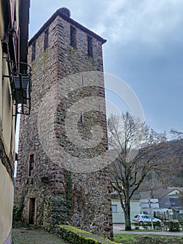 Medieval stone tower with preserved historic architecture in European village