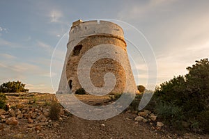 Medieval tower of Sal Rossa at sunrise in Ibiza