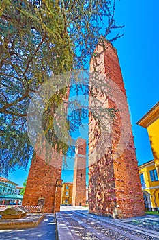 Medieval towers of red brick are the most unique landmarks in old Pavia, Italy