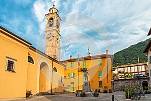Medieval town square with church Chiesa Santo Stefano and colorful buildings in Lenno comune on Como lake, Lombardy photo