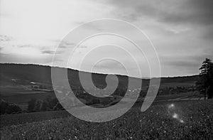 The medieval village of Bachs in Switzerland at the heart of a valley in the Swiss Alps, shot with analogue black and white