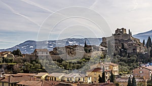 The medieval village of Castiglione d`Orcia against the snow-covered hills, Siena, Tuscany, Italy