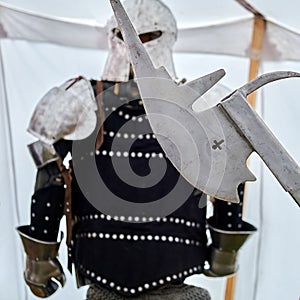 Medieval vintage armor and retro warrior helmet. Reconstruction of the events of the Middle Ages in Europe