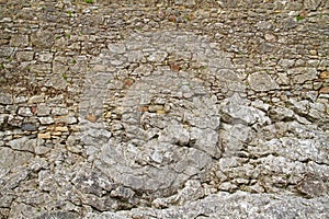 Medieval wall built on rock