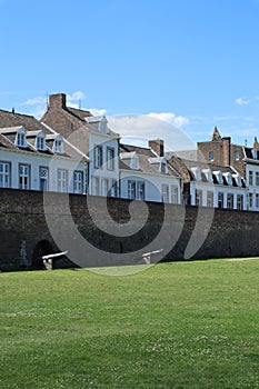 Medieval wall and houses behind, in Maastricht, Netherlands